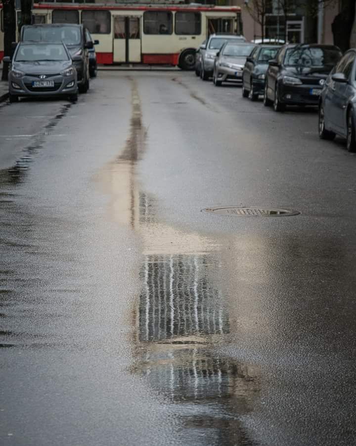 Reflections of Vilnius on a rainy day #vilnius #easteurope #urban #city #rain #lithuania #europe #ig_vilnius #ig_europe #ig_urban #tram #puddle #scandiaphoto